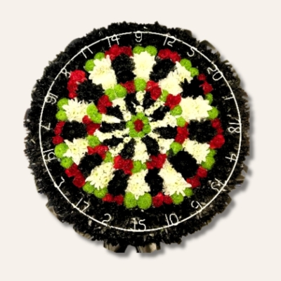 Dart board-shaped funeral tribute made with mixed chrysanthemum and finished with a genuine wired dart board surround, measuring approximately 20 inches.