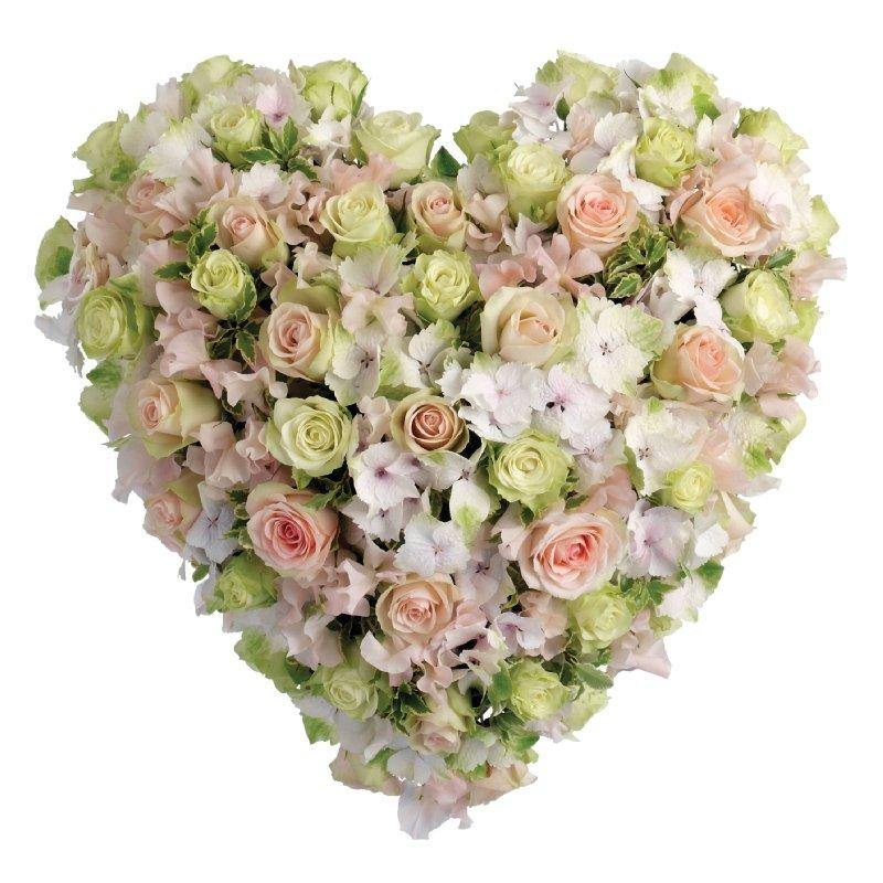 Pink and white funeral heart tribute with luxury flowers and soft seasonal blooms.