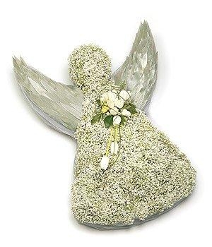 Angel-shaped funeral tribute made with massed white gypsophila and silver layered leaf wings, featuring a white floral focal point.