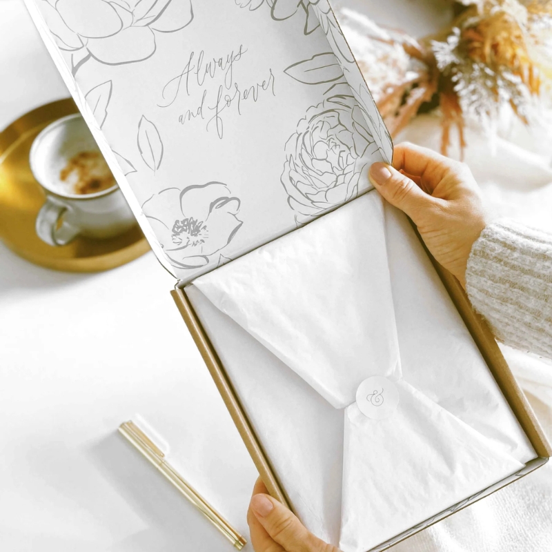 Blush & Gold Eucalyptus wedding planner with green botanical cover and gold detailing.