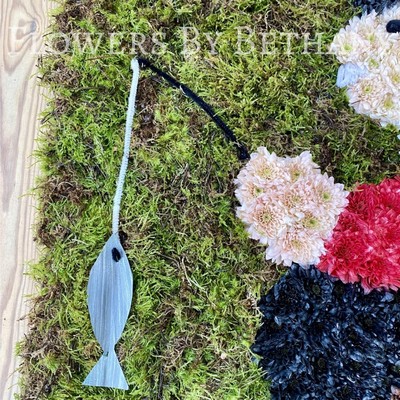 Fishing-themed funeral tribute created on a 24