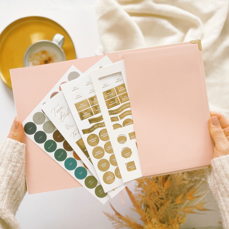 Blush & Gold Floral wedding planner with pastel floral cover and gold detailing.