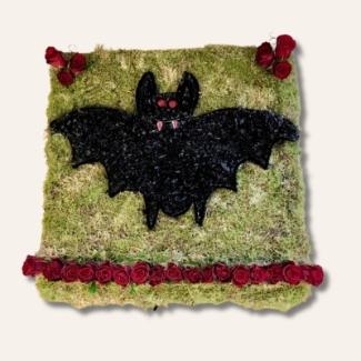 Bat-shaped funeral tribute on a 24
