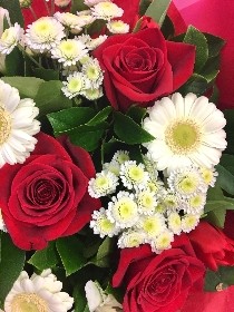 Red and white romantic flower bouquet, hand-tied and gift wrapped.