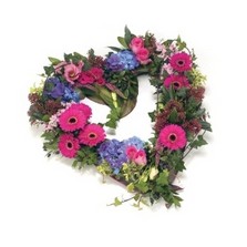 Funeral heart tribute with an open, textured design in vibrant pink and blue tones.