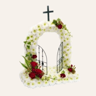 Gates of Heaven funeral tribute with white chrysanthemum base and red focal, 20 x 18 inches, customisable flower colours.